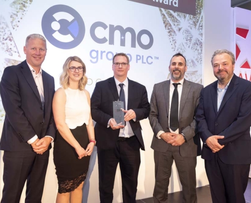 Abby Weeks, Martin Winterburn and Ben Hodson from CMO Group PLC receiving the DIY Week Award 2022 for Business Expansion of the Year